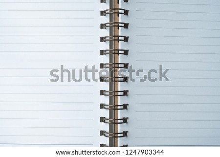Top view notebook on wooden table with copy space for text.