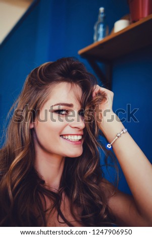 smiling young woman doing selfie in the room