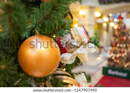 Bright shiny ball on a Christmas tree
