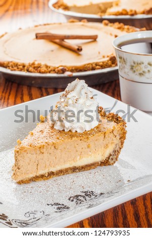 Beautifully plated slice of pumpkin pie