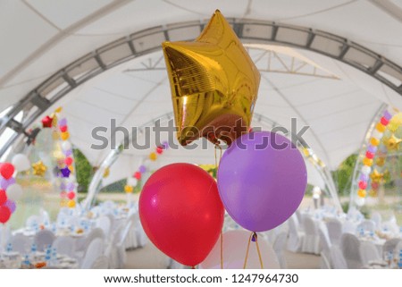 Colored balloons in white interior