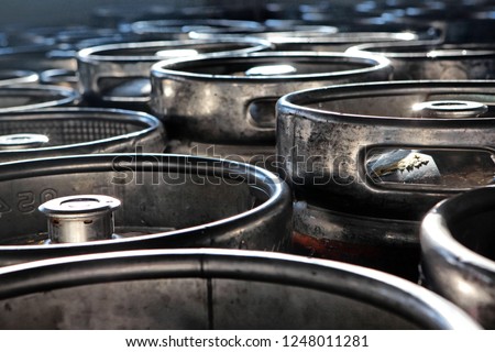 Large barrels or containers for beer in industrial production of metal in large quantities. The concept of production. Royalty-Free Stock Photo #1248011281
