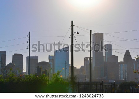 The downtown Houston skyline rises on a clear day.