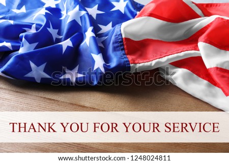 Text THANK YOU FOR YOUR SERVICE and USA flag on wooden background