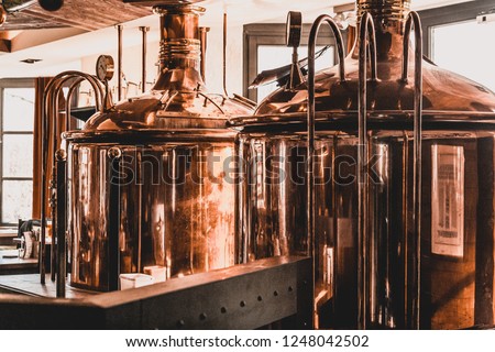 Beer tanks in production and outside the window sunny day Royalty-Free Stock Photo #1248042502
