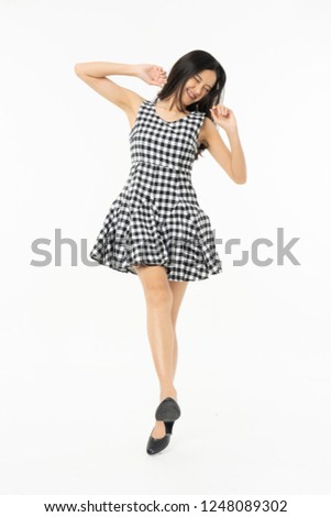 portrait of excited surprised attractive careless inspired girl jumping up isolated on background.Freedom legs stylish feet glamorous people teenager asian.