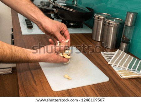 Man peeling garlic