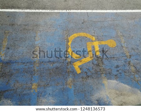 Background of the disable sign at parking lot on the street 
