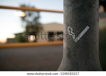 Closeup cigarette smoking area sign at Tomprice construction mine site, Perth, Australia
