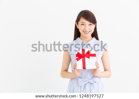 young attractive asian woman having a present