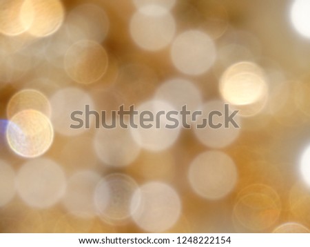 Festive and warm christmas background. golden lights and glow circles defocus effect.
