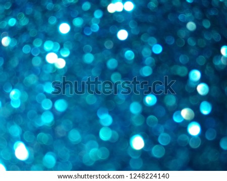 Abstract blue bokeh blurred background.