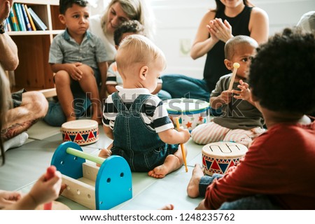 Cute little kids playing together Royalty-Free Stock Photo #1248235762