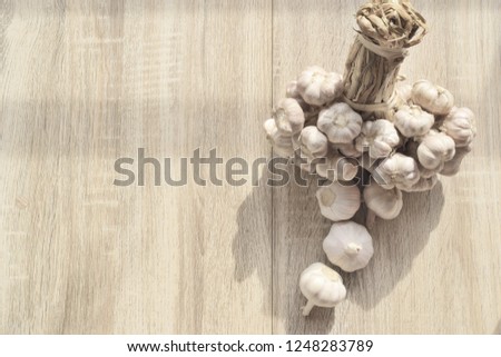 garlic bundle is included on wooden floor