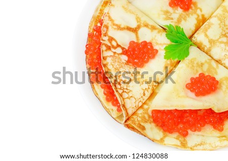 Pancakes with red caviar on a plate isolated on white background