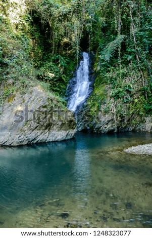 waterfall in deep forest, digital photo picture as a background