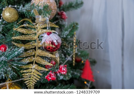Christmas tree branch with colorful bauble isolated on blur background, festive border, New Year greeting card, magic night, glowing backdrop, xmas decoration, holiday ornament.Decorated fir tree