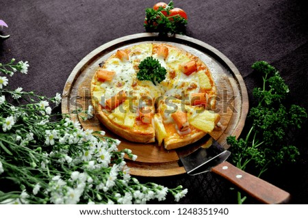 Pizza on wooden tray
