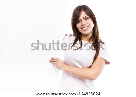 Portrait of a young woman with blank billboard isolated on white background