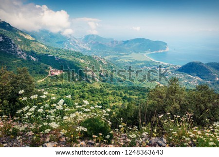 Spectacular morning seascape of Adriatic sea with Petrovac town on background. Amazing summer view of Montenegro countryside. Beautiful world of Mediterranean countries. 