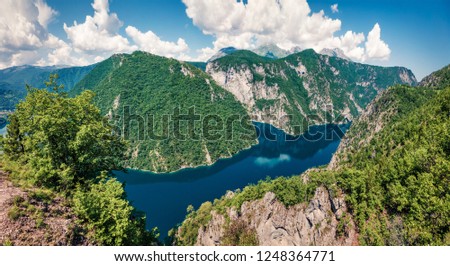Aerial summer view of Pivsko lake. Picturesque scene of canyon of Piva river, Pluzine town location, Montenegro, Europe. Beautiful world of Mediterranean countries. Traveling concept background.