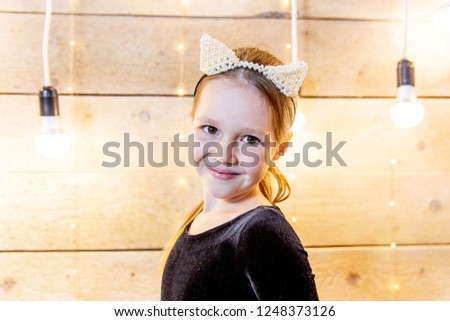 Portrait of a teen girl in a costume of a cat