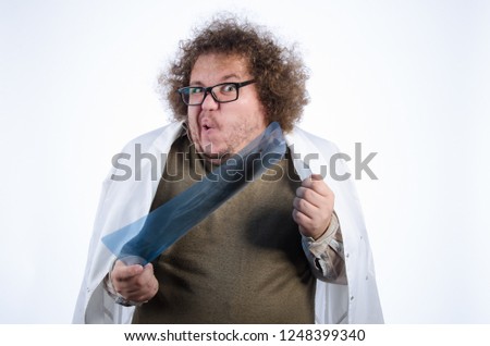 Funny fat doctor. White background.  Royalty-Free Stock Photo #1248399340