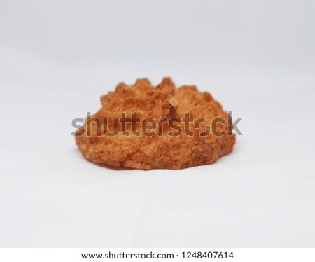 Sweet coconut cookies isolated on a light grey background
