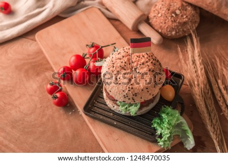Hamburger homemade on wood table with copy space.