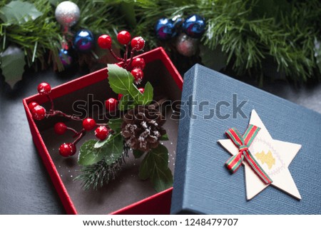 Christmas box and gift basket. A supermarket basket with money.