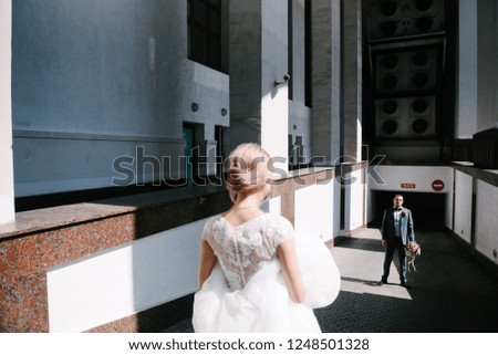 Bride and groom posing in the city
