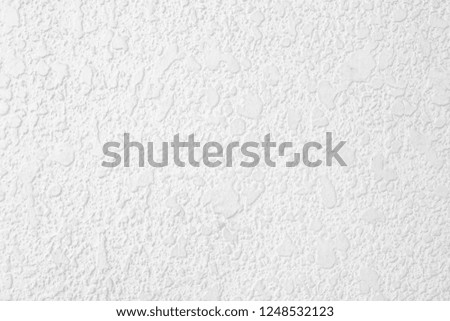 Abstract of a wall has a pattern of water, gravel, rugged
