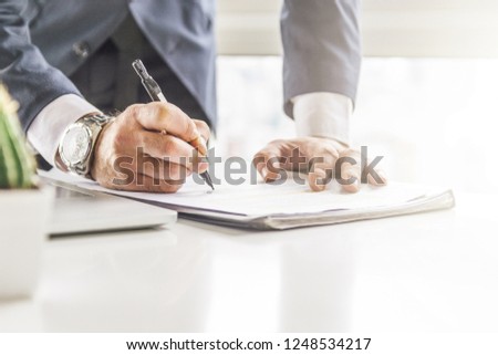 Close up business man signing contract making a deal, classic business