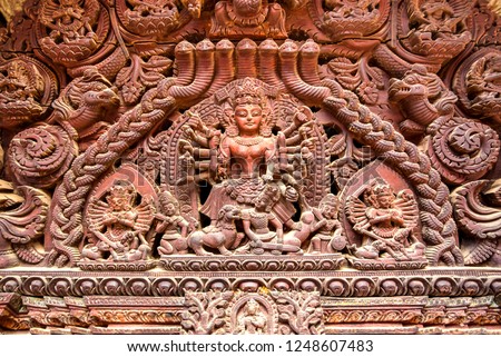 Detail of an decorated entrance in the Bhaktapur Durbar Square, the plaza in front of the destroyed royal palace of the old Bhaktapur Kingdom, Kathmandu valley, Nepal. Royalty-Free Stock Photo #1248607483