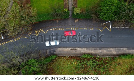 Aerial view of a school keep clear road sign in the UK