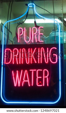 pure drinking water neon advertising sign in a store window