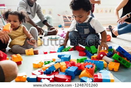 Diverse children enjoying playing with toys Royalty-Free Stock Photo #1248701260