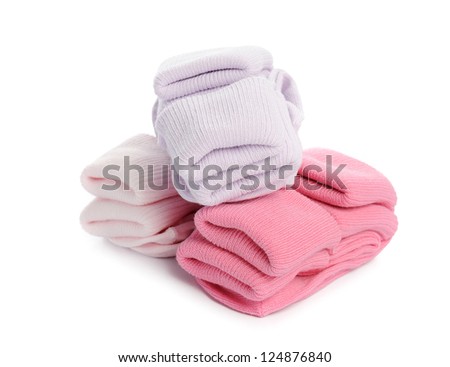 colorful of new kid's baby socks stacked and isolated on white background