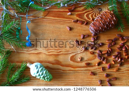2023 New year background. Wooden base. pine nuts. cedar bump 
