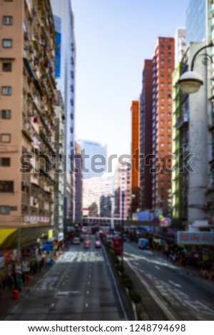 (blurred picture) Tourists and local traffic on the streets of Hong Kong, China. Hong Kong is a special administrative region on the eastern side of the Pearl River estuary in southern China.