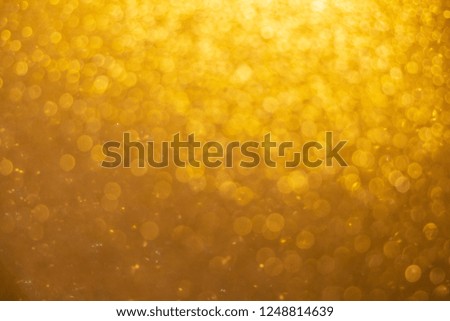 Abstract twinkled bright background with blurred bokeh gold Christmas  lights.background.