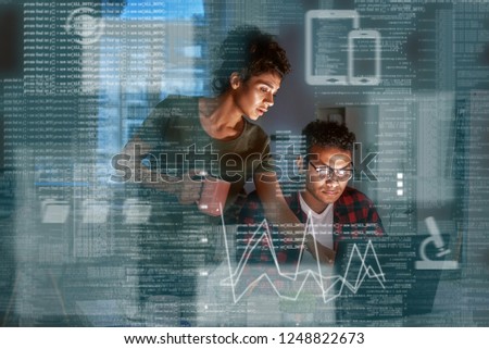Young indian developer and his project manager discussing application code