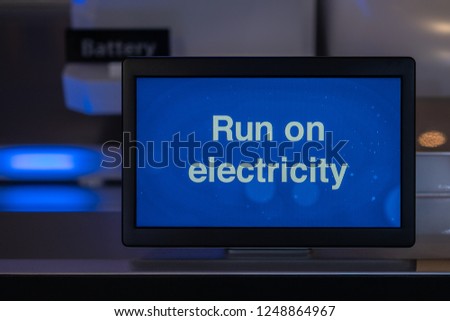 Run on electricity text on screen. Hybrid vehicle technology concept.