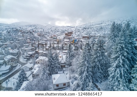Aerial View of Seli Traditional Greek Village Covered by Snow in Winter Morning. Top Tourist Destination in Northern Greece
