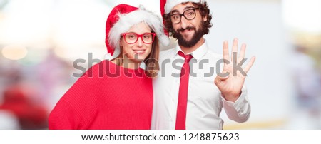 young couple expressing christmas concept. as Santa Claus hat 