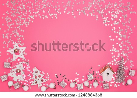 Christmas greeting card. Christmas white and silver decorations on bright pink background. Copy space, top view. Flat lay, Christmas, winter, new year concept.