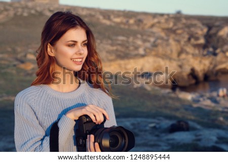 Woman photographer in nature                        
