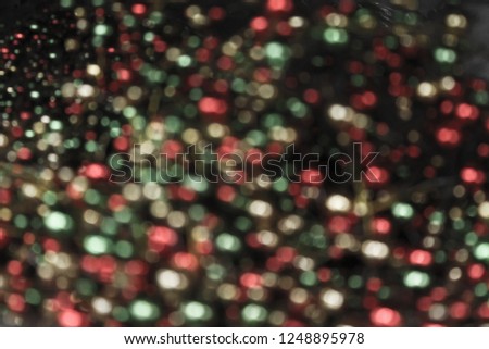 Background of defocused bokeh lights different colors. Can be used as background for greetings, cards, photos.