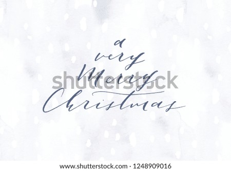Elegant hand painted Christmas festive greeting card. Winter blue cold hand drawn postcard. Calligraphy brush lettering. Stylish minimalist nordic frost watercolor background snow texture and frame.