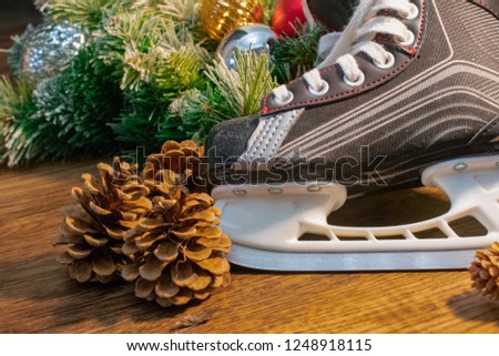 Hockey skates in Christmas background with wreath and ornaments 